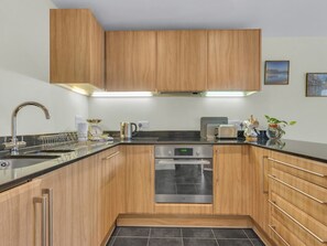 Oven, dishwasher, toaster, dining tables