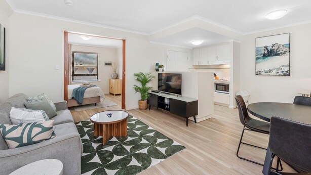 A modern apartment with a living room, dining area, kitchenette, and a bedroom. - Spacious 1bdr Fast Wi-fi Near RAC Arena (Perth)