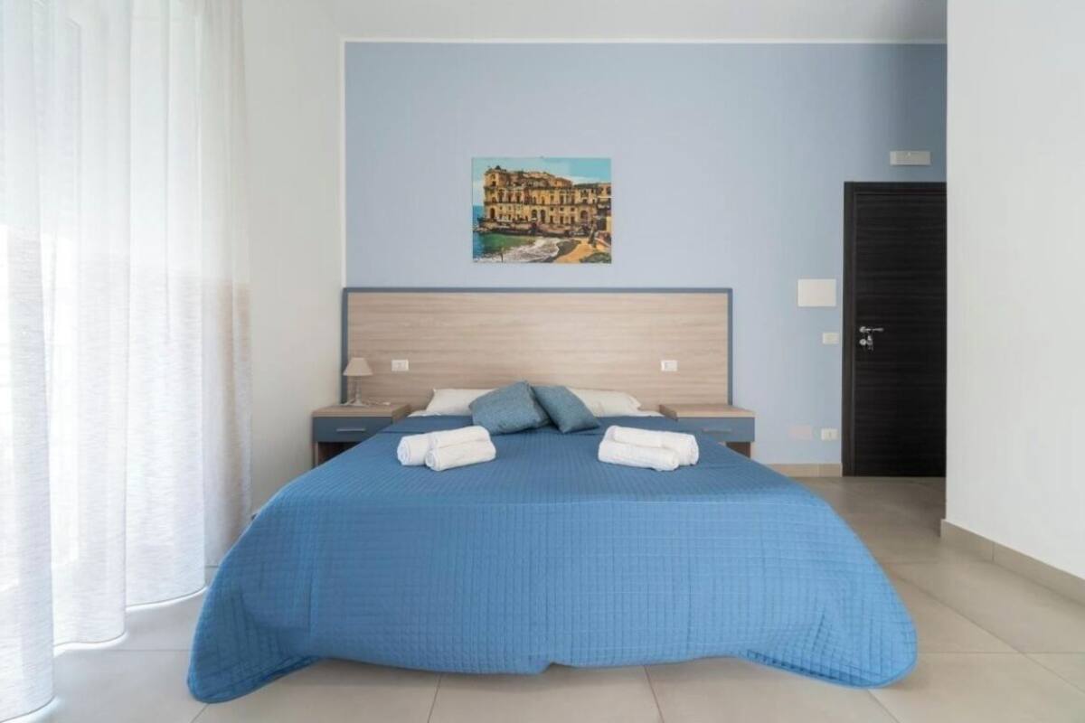 Deluxe Triple Room, Balcony | Desk, laptop workspace, free WiFi