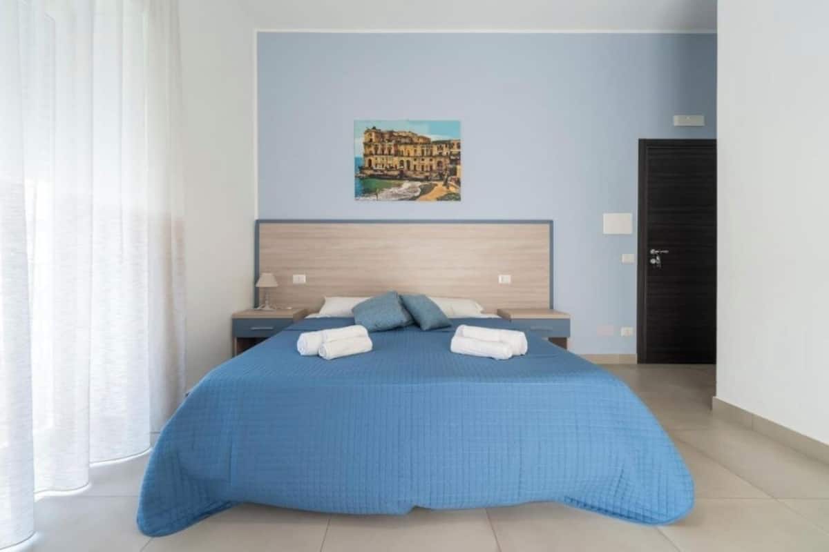 Deluxe Triple Room, Balcony | Desk, laptop workspace, free WiFi