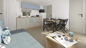 Ein moderner, kompakter Wohnraum mit Küchenzeile, Essbereich und einem kleinen Tisch mit Lektüre.