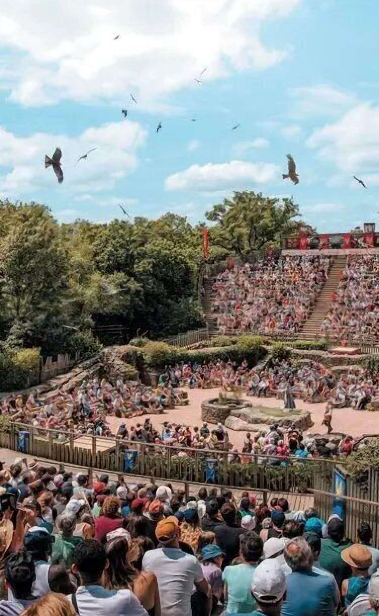 Um anfiteatro ao ar livre lotado, com assentos em terraços e palco central.