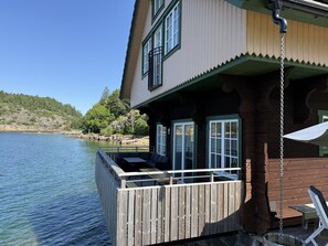 Terrace/patio - Log cabin with pool, sauna and boat by Torreby Castle | SE09080 (Munkedal)