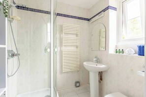 Shower, hair dryer, towels