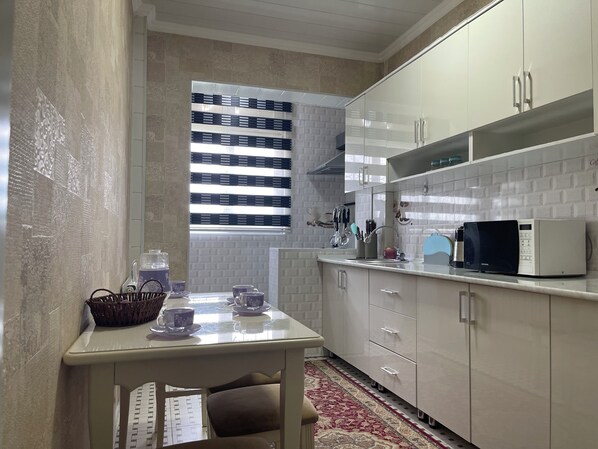 Fridge, microwave, oven, cookware/dishes/utensils
