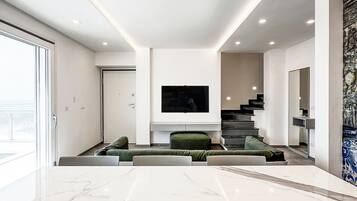 Villa, 2 habitaciones, alberca privada, vista al mar | Área de sala de estar | Televisión de 30 pulgadas con canales vía satélite