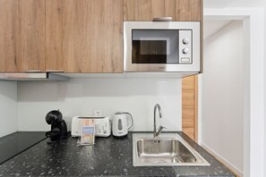 Fridge, microwave, coffee/tea maker, toaster