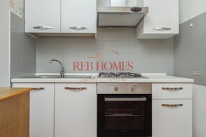 Fridge, microwave, stovetop, cookware/dishes/utensils