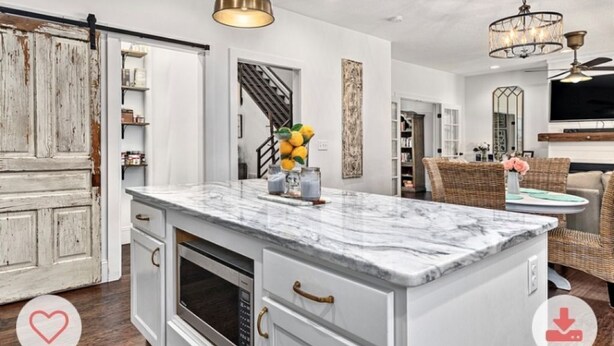 A kitchen with white cabinetry, a marble island, and pendant lighting. - Charming 3-bedroom farmhouse with Pool &Hot Tub in Asheville Fletcher area (Fletcher)