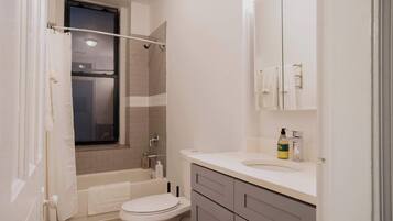 Shower, hair dryer, towels, shampoo