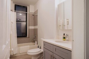 Shower, hair dryer, towels