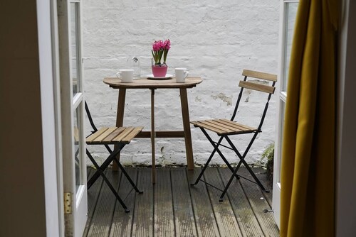 Spacious bedroom in characterful period flat.