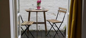 Spacious bedroom in characterful period flat.