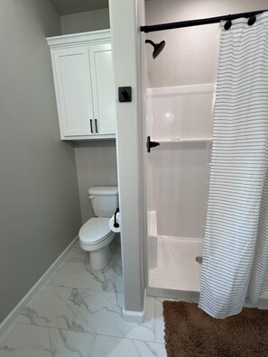 Shower, hair dryer, towels, soap