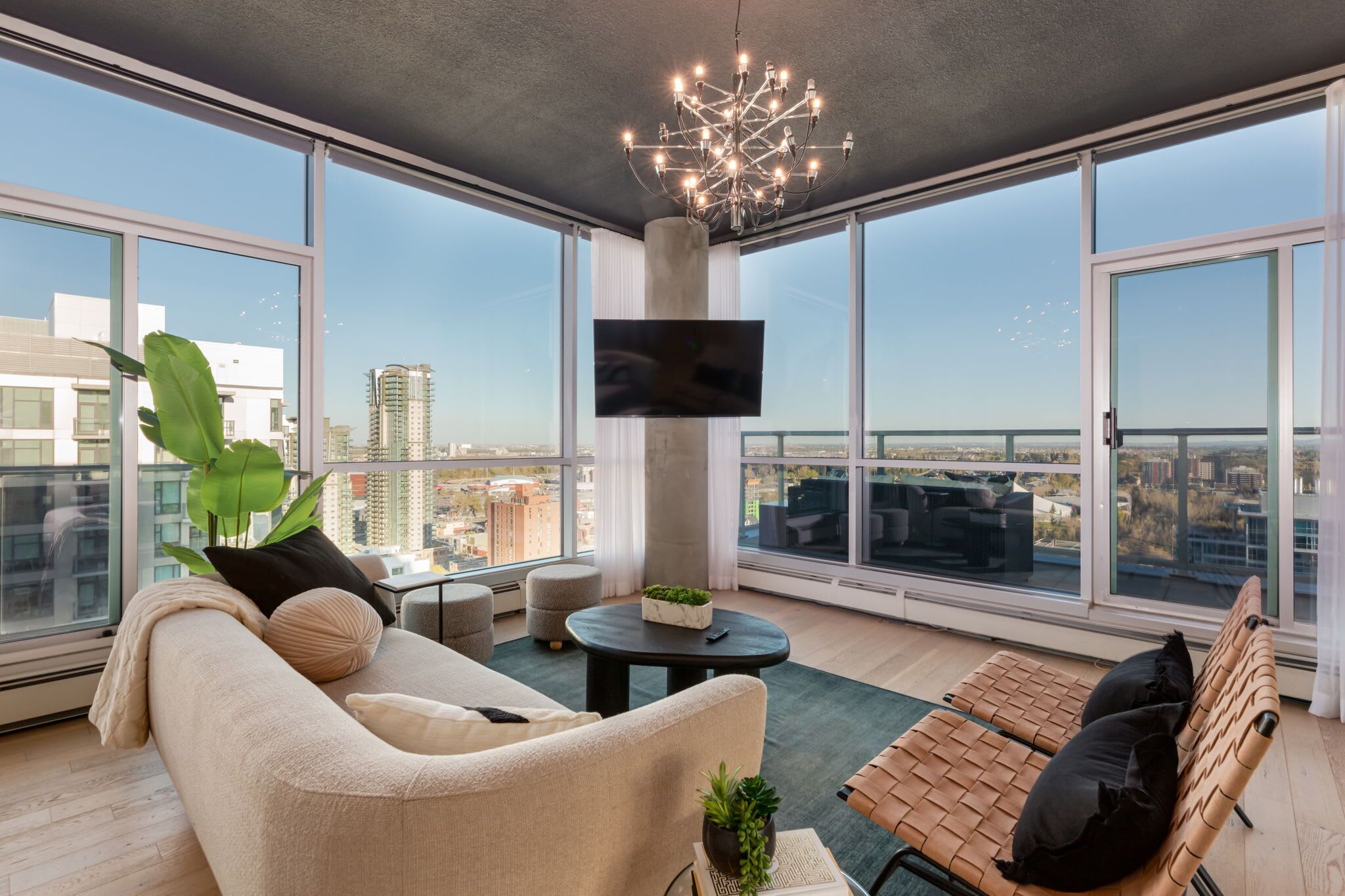 Stylish two-storey penthouse with floor-to-ceiling windows and downtown skyline views
