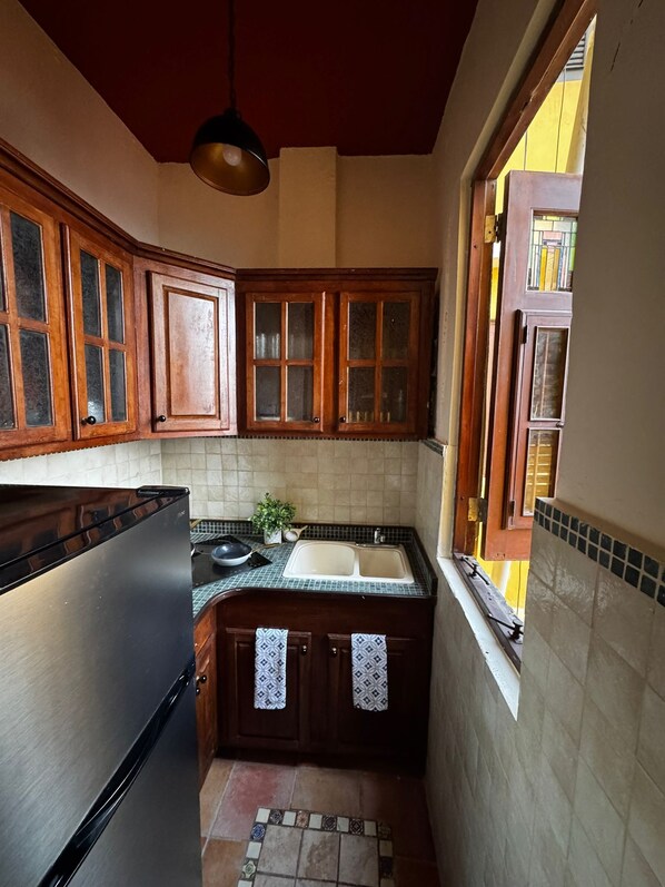 Fridge, microwave, stovetop, coffee/tea maker