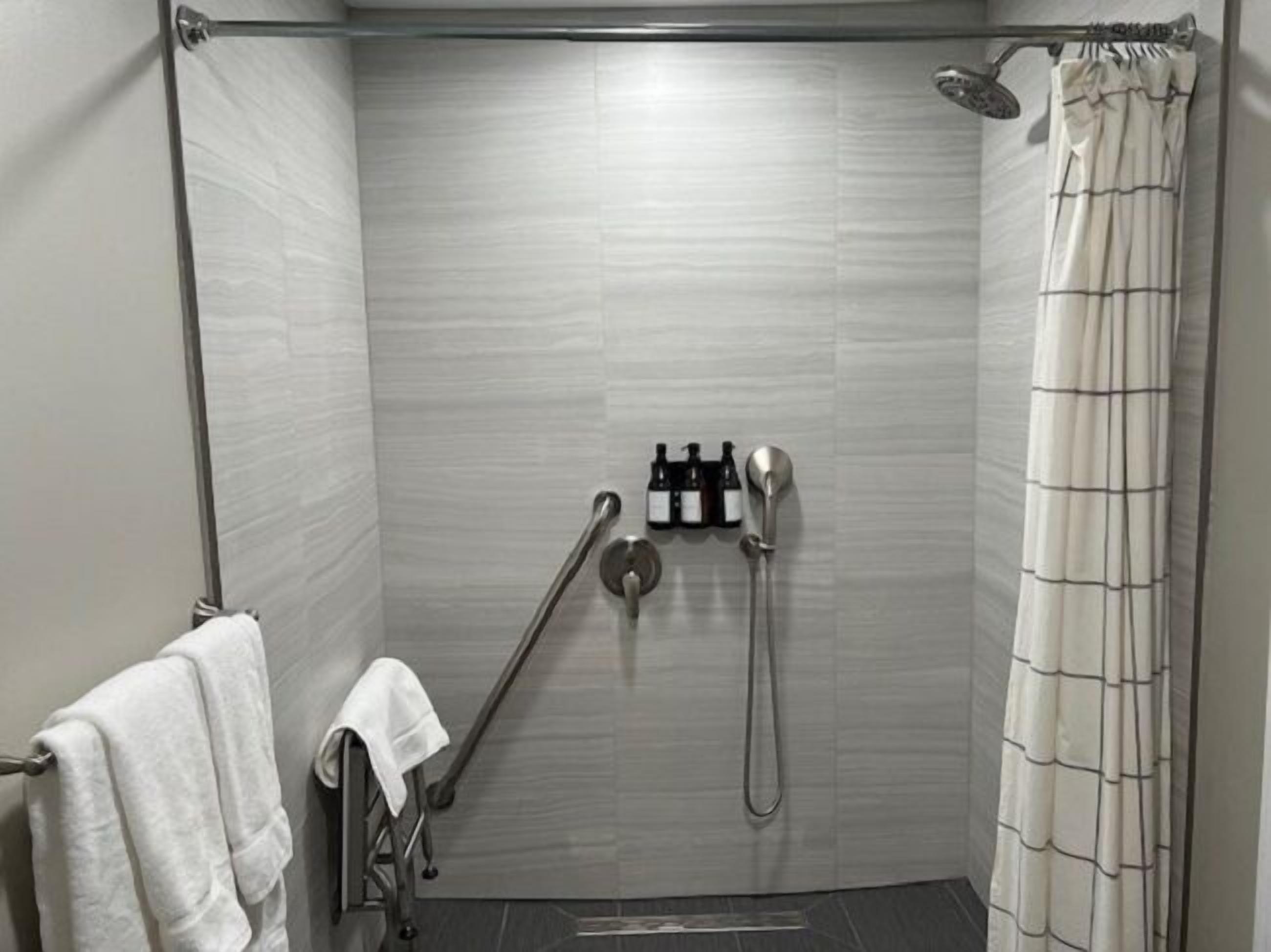 Room, 1 Queen Bed, Mobility Accessible (Outpost) | Bathroom | Combined shower/tub, hair dryer, towels, soap