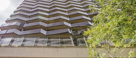A modern building with a zigzagged facade and large windows.