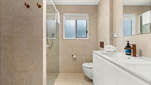 Shower, hair dryer, towels