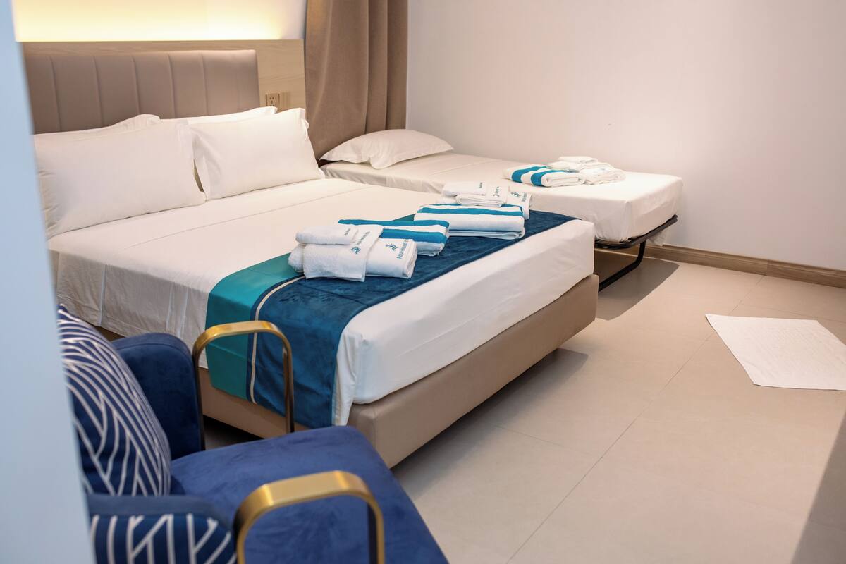Deluxe Triple Room | In-room safe, blackout drapes, iron/ironing board, free WiFi