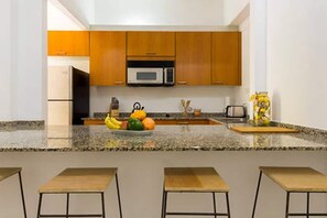 Fridge, microwave, stovetop, coffee/tea maker