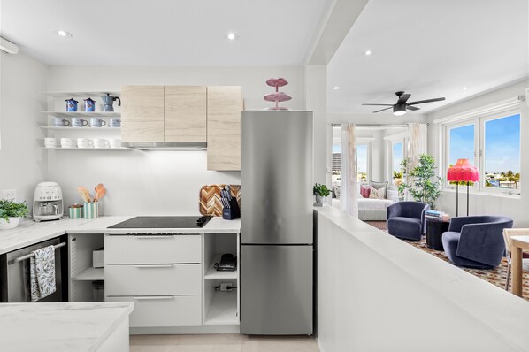 Fridge, microwave, stovetop, coffee/tea maker