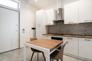 Fridge, oven, coffee/tea maker, cookware/dishes/utensils