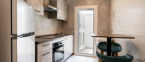 Fridge, oven, coffee/tea maker, cookware/dishes/utensils