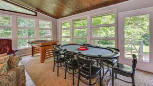 A room with a pool table, four chairs, a foosball table, and large windows offering a view of trees. - Golf Course Views & Games Galore - Vine Grove Gem! (Vine Grove)
