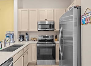Oven, dishwasher, coffee/tea maker, cookware/dishes/utensils