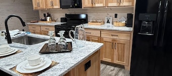 TAKE IT EASY Fishing Cabin. Large enclosed bay for storing the boat.