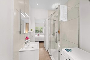 Shower, hair dryer, towels