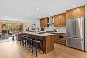 Fridge, microwave, oven, stovetop - Luxury Mountain Villa | Private Hot Tub (Canmore)