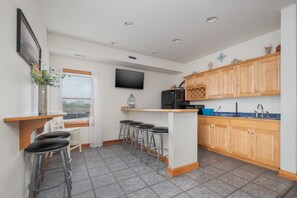 Fridge, microwave, oven, stovetop - 7017- Rodanthe Fantasea, a home in Rodanthe, NC, an 8 BR with stunning ocean views. (Rodanthe)