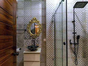 Shower, towels, soap, toilet paper
