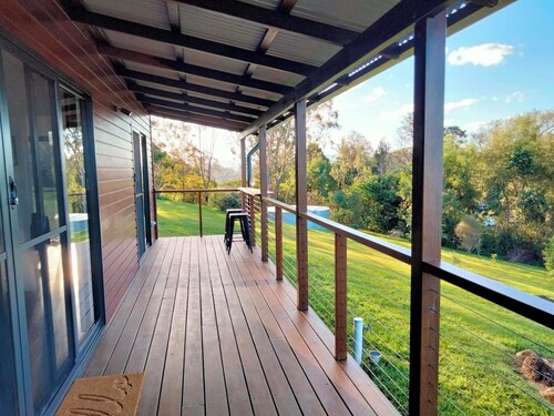 Girayir Cottage. Nestled amongst native gardens in the Byron hinterland.