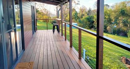 Girayir Cottage. Nestled amongst native gardens in the Byron hinterland.