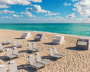 On the beach, sun-loungers, beach towels