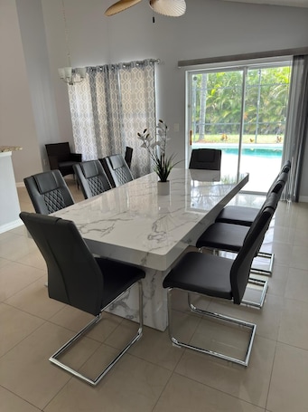 Dining. Charming 3-bedroom house with WiFi, AC, Pool, Lake View, by Disney.