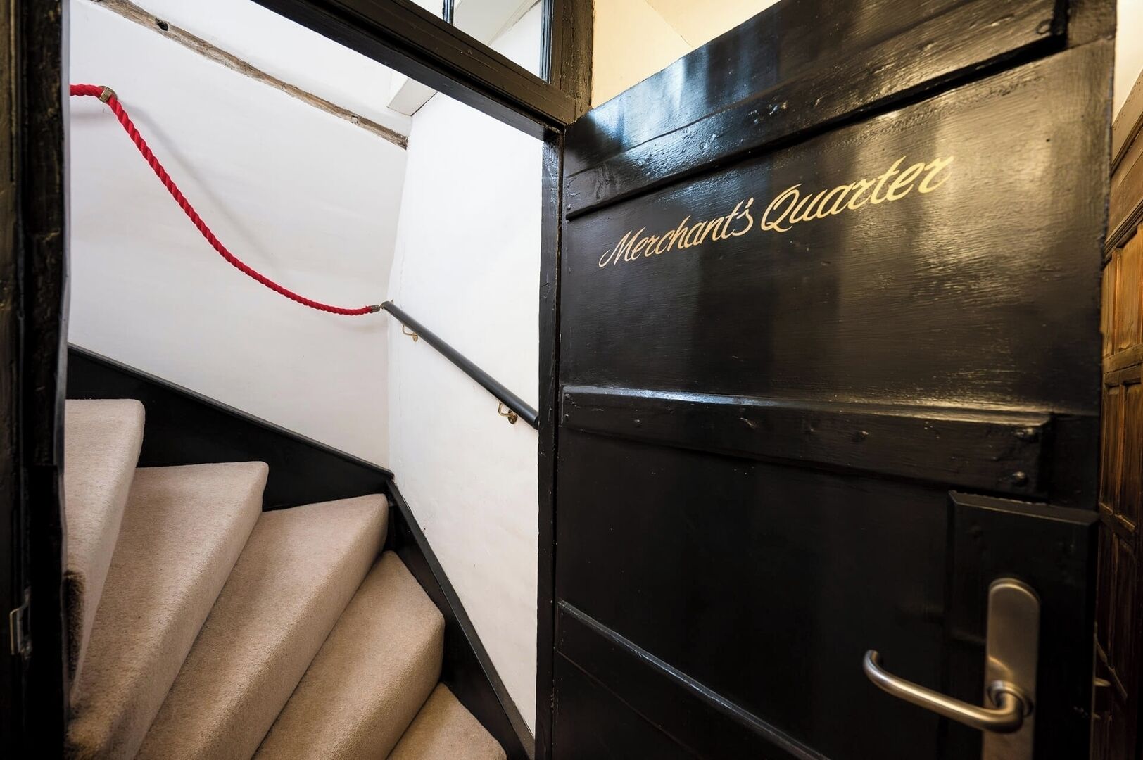 A staircase leading to a room labeled "Merchant's Quater."