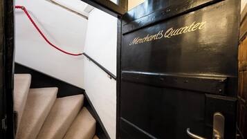 A staircase leading to a room labeled "Merchant's Quater."