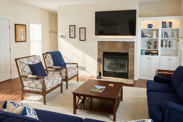 Cozy up and unwind in this sunlit, newly updated living room.