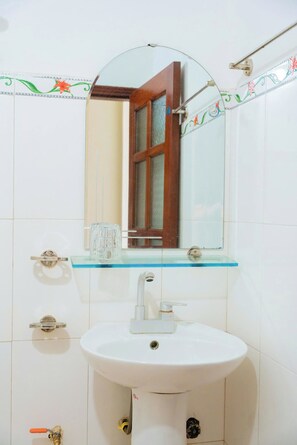 Shower, hair dryer, slippers, towels