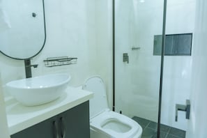 Shower, towels, soap, toilet paper