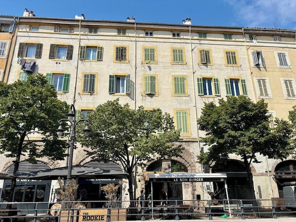 A historic building with multiple windows and a central entrance.