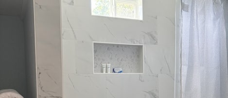 Shower, hair dryer, towels, soap