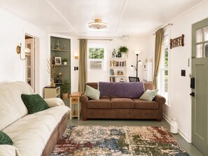 Living area - Charming 2 BR, nestled on Buckhannon River, with deck, dock, fire-pit, & kayaks (Volga)