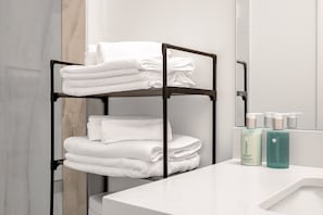 Hair dryer, towels, soap, toilet paper