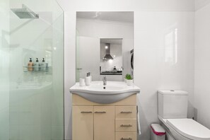 Shower, hair dryer, towels, soap