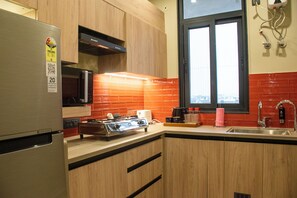 Luxury Apartment | Private kitchenette | Fridge, microwave, stovetop, electric kettle